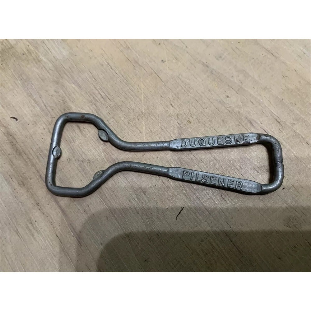 VINTAGE DUQUESNE PILSENER SILVER TOP BEER ADVERTISING BOTTLE OPENER